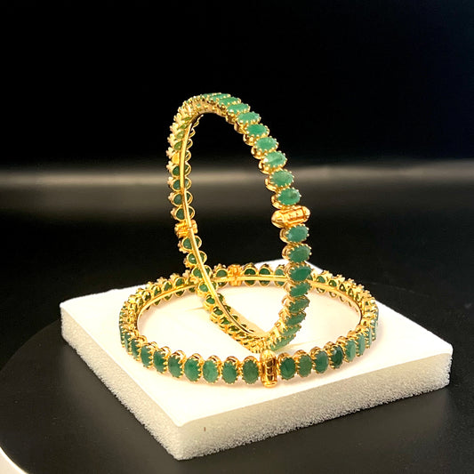 Exemplifying Emerald Bangles