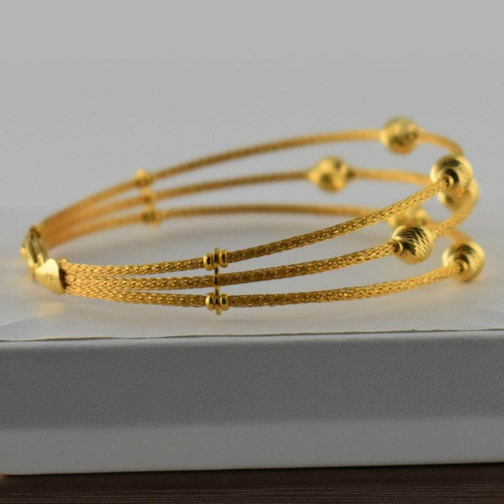 Sleek Cuff Bracelet with Gold Balls