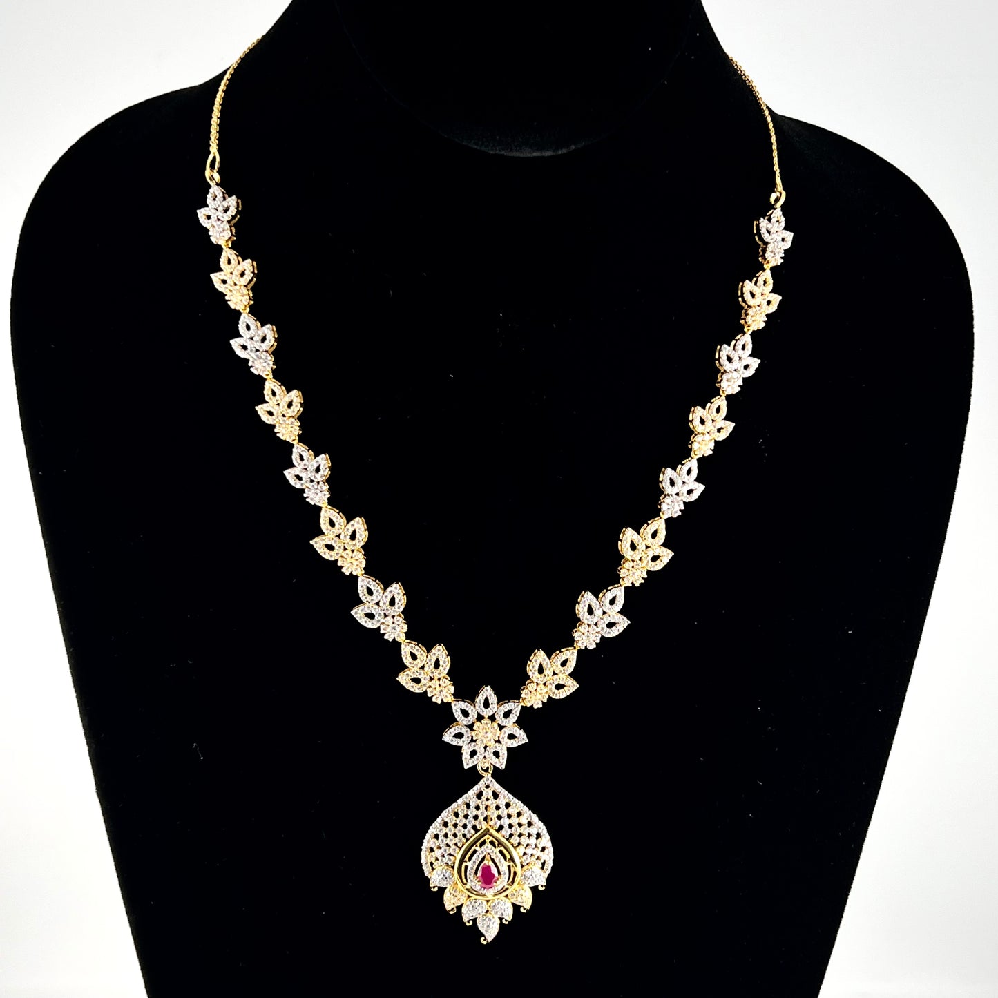Glittering Cubic Zarconia Necklace with Singular Ruby Colored Stone